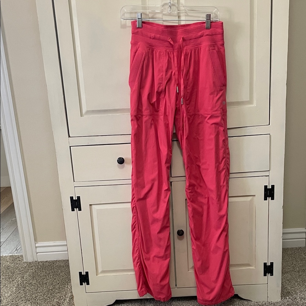 lululemon athletica Pink Dance Studio pants.  Mid-rise, regular length.